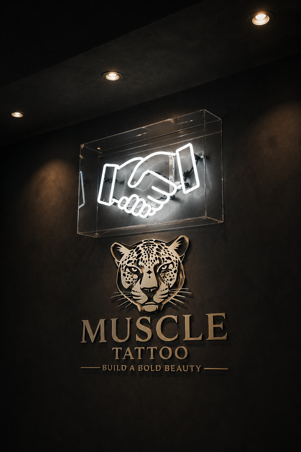 A dark textured wall featuring a glowing white neon sign of a handshake inside a clear case.